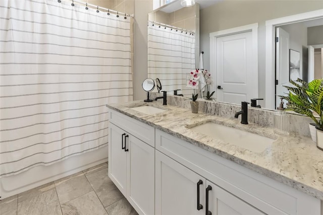 full bathroom with double vanity, a sink, and shower / bath combo with shower curtain