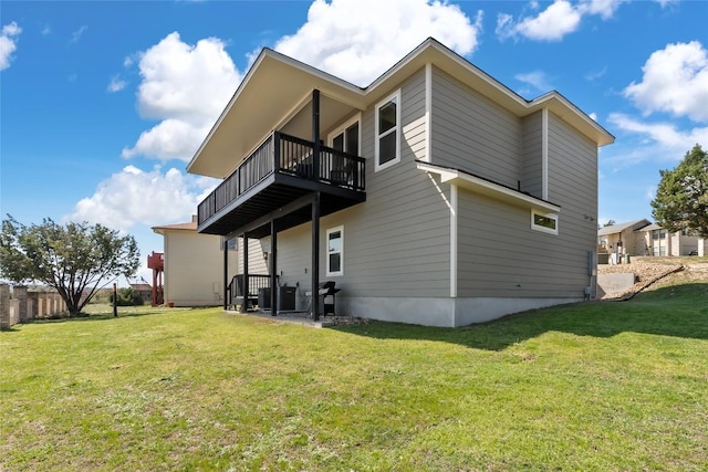 315 Southwind Rd, Point Venture, TX 78645 - back of property with a balcony and a lawn
