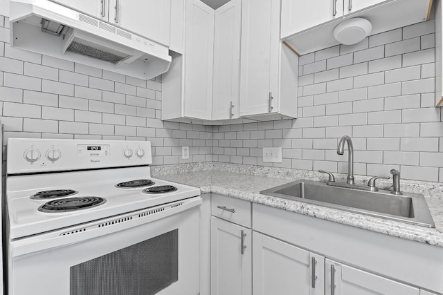 1840 Burton Dr Unit 133, Austin, TX 78741 - kitchen with electric stove, exhaust hood, a sink, tasteful backsplash, and white cabinetry