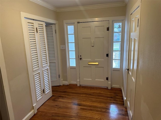 foyer with crown molding, baseboards, and dark wood-style floors