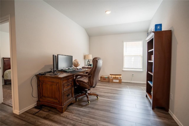 168 Onna St, Taylor, TX 76574 - home office featuring wood finished floors and vaulted ceiling