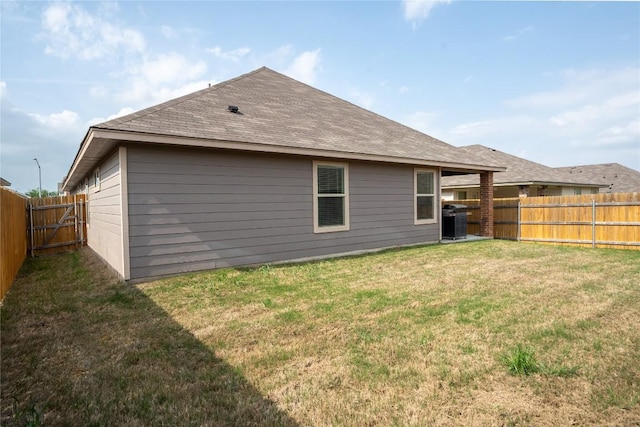 168 Onna St, Taylor, TX 76574 - rear view of house with a fenced backyard and roof with shingles