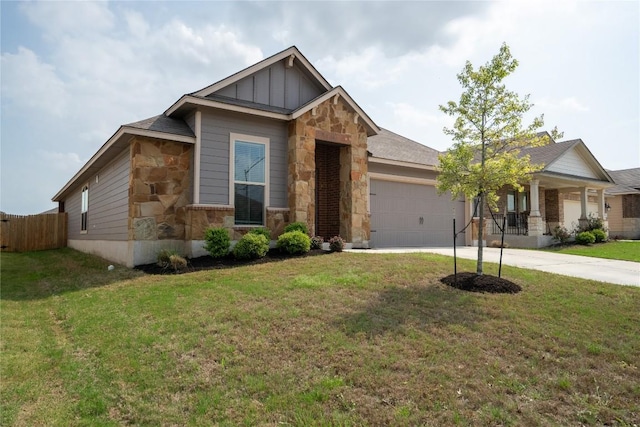 168 Onna St, Taylor, TX 76574 - craftsman-style home with stone siding, a garage, concrete driveway, board and batten siding, and a porch