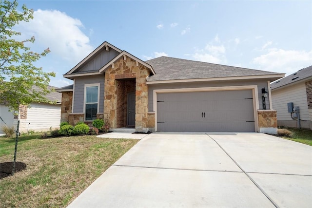 168 Onna St, Taylor, TX 76574 - view of front of house featuring stone siding, concrete driveway, an attached garage, board and batten siding, and a front lawn