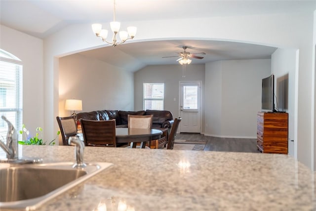 168 Onna St, Taylor, TX 76574 - kitchen with vaulted ceiling, wood finished floors, a chandelier, ceiling fan, and open floor plan