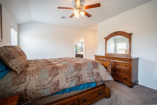 168 Onna St, Taylor, TX 76574 - carpeted bedroom featuring lofted ceiling, a ceiling fan, and ensuite bath