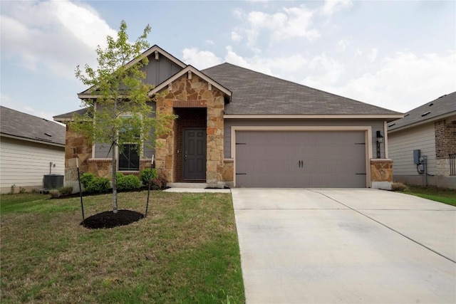 168 Onna St, Taylor, TX 76574 - view of front of house with stone siding, a garage, concrete driveway, and a front yard