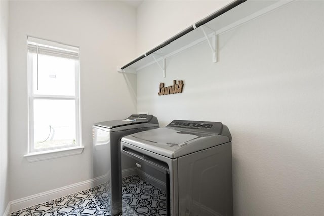 306 Gulfton St, Austin, TX 78738 - laundry room featuring healthy amount of natural light, washer and clothes dryer, and tile patterned flooring