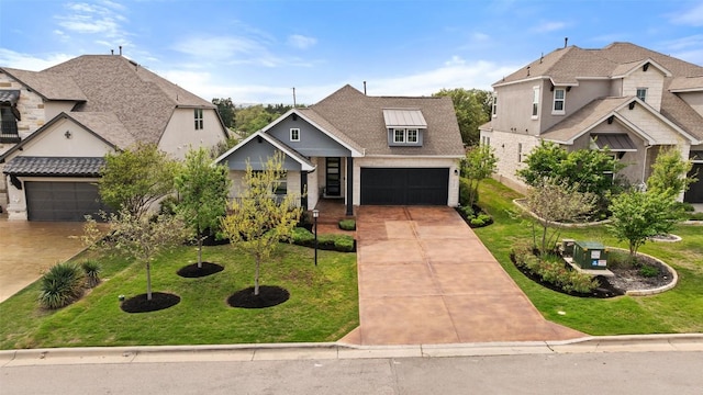 306 Gulfton St, Austin, TX 78738 - view of front of home featuring driveway, a front lawn, and an attached garage