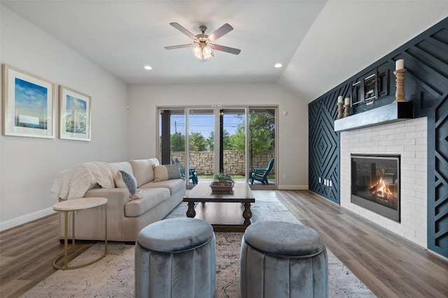 306 Gulfton St, Austin, TX 78738 - living area with wood finished floors, baseboards, a fireplace, a ceiling fan, and recessed lighting