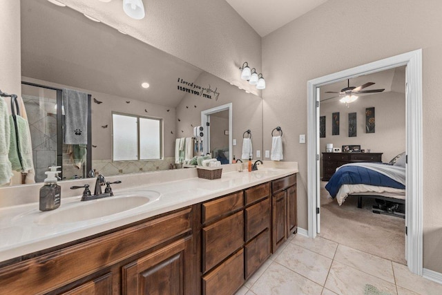 11066 La Paloma Loop, Salado, TX 76571 - bathroom featuring double vanity, tile patterned floors, lofted ceiling, connected bathroom, and a shower stall
