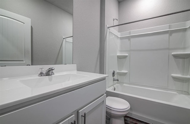 5912 Berriweather Dr, Austin, TX 78724 - full bathroom featuring vanity, a textured wall, toilet, wood finished floors, and shower / tub combination