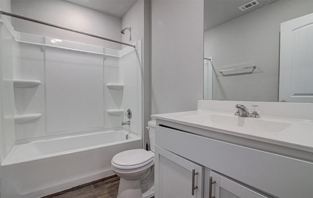 5912 Berriweather Dr, Austin, TX 78724 - full bathroom featuring vanity, wood finished floors, toilet, and bathing tub / shower combination