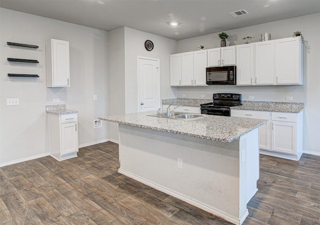 5912 Berriweather Dr, Austin, TX 78724 - kitchen featuring black appliances, a sink, dark wood-type flooring, white cabinets, and recessed lighting