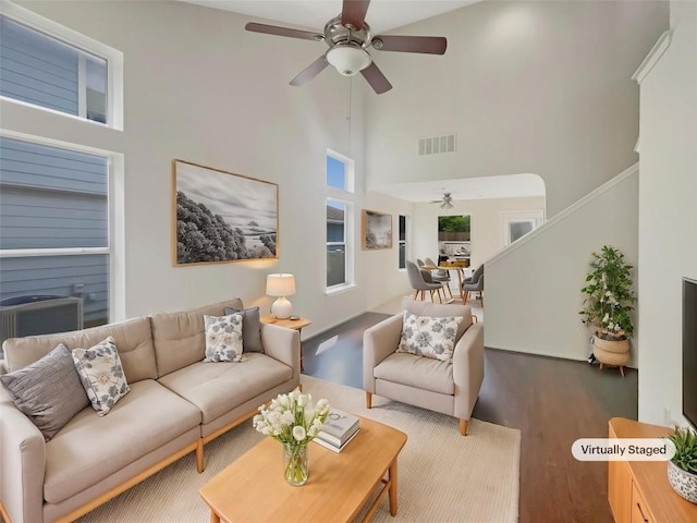 1427 Davis Mountain Loop, Cedar Park, TX 78613 - living room featuring ceiling fan, a high ceiling, wood finished floors, and stairway
