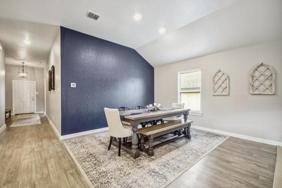 5907 Akin Run, San Antonio, TX 78261 - dining room with light wood finished floors, baseboards, lofted ceiling, and a chandelier