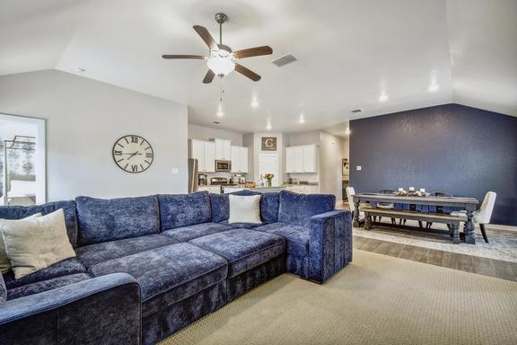 5907 Akin Run, San Antonio, TX 78261 - living room with lofted ceiling, ceiling fan, and light wood-style floors