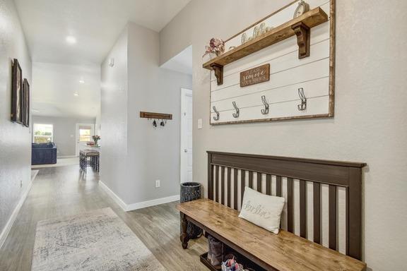 5907 Akin Run, San Antonio, TX 78261 - hallway featuring wood finished floors and baseboards