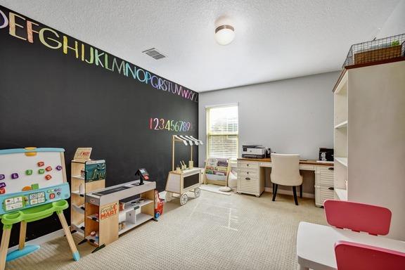 5907 Akin Run, San Antonio, TX 78261 - home office featuring carpet flooring and a textured ceiling