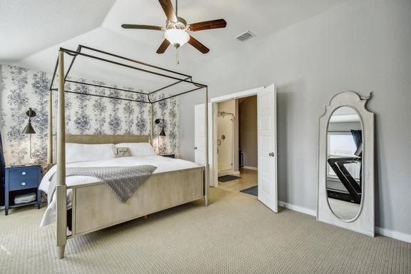5907 Akin Run, San Antonio, TX 78261 - bedroom with light colored carpet, lofted ceiling, baseboards, and a ceiling fan