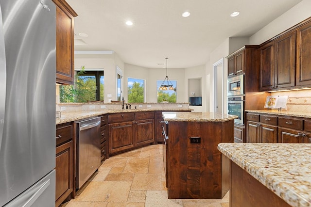 201 Aldea St, Georgetown, TX 78633 - kitchen featuring stainless steel appliances, recessed lighting, stone tile flooring, tasteful backsplash, and light stone countertops
