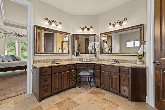 201 Aldea St, Georgetown, TX 78633 - full bathroom with stone tile flooring, healthy amount of natural light, and double vanity