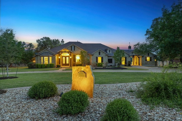 201 Aldea St, Georgetown, TX 78633 - view of front of house with a chimney, a front yard, and stone siding