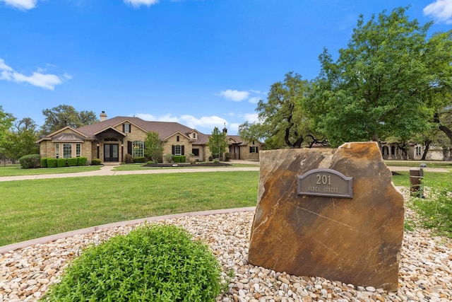 201 Aldea St, Georgetown, TX 78633 - view of front of house with a front yard and a chimney