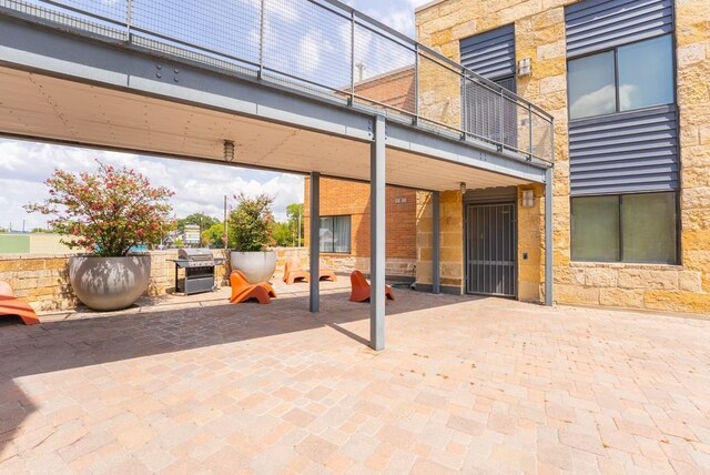 3016 Guadalupe St Unit 212, Austin, TX 78705 - view of patio / terrace featuring a grill