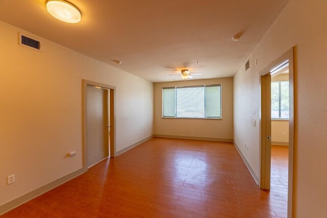 3016 Guadalupe St Unit 212, Austin, TX 78705 - unfurnished room with light wood-type flooring, ceiling fan, and a smoke detector