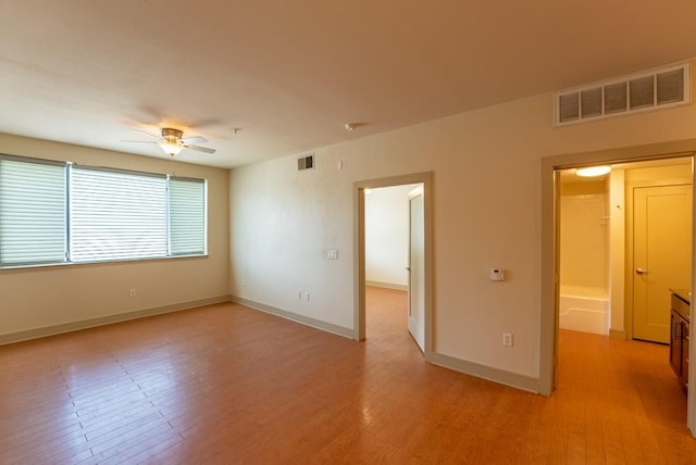 3016 Guadalupe St Unit 212, Austin, TX 78705 - spare room featuring ceiling fan and light wood-style floors