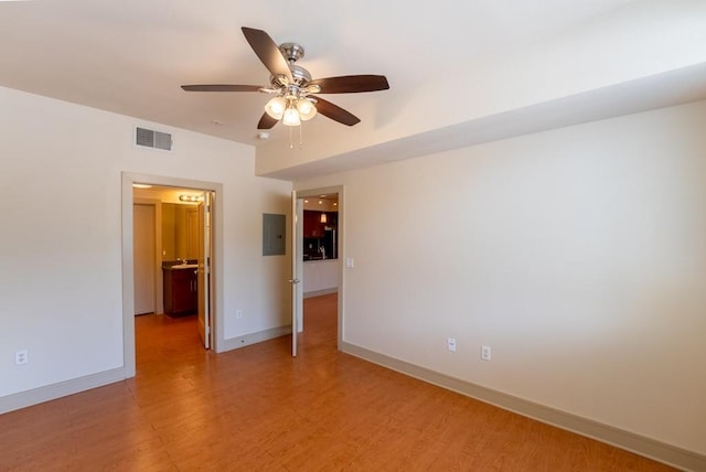 3016 Guadalupe St Unit 212, Austin, TX 78705 - unfurnished room with a ceiling fan, electric panel, and light wood-type flooring