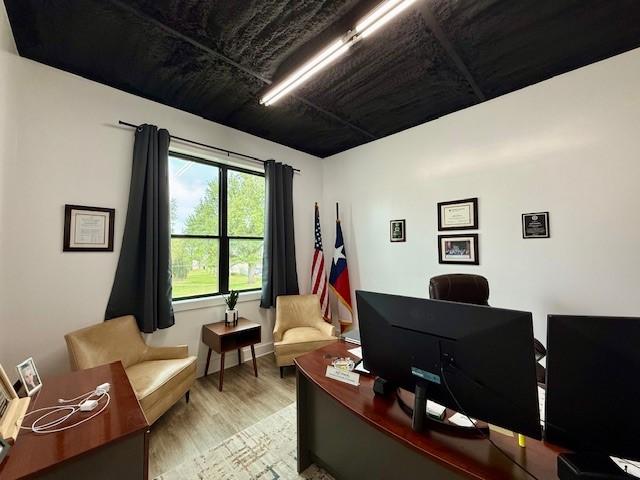 617 Main St, Lexington, TX 78947 - home office featuring wood finished floors