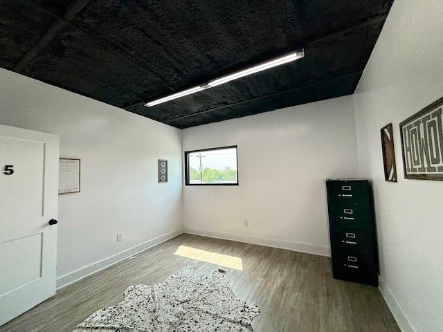 617 Main St, Lexington, TX 78947 - unfurnished room with wood finished floors