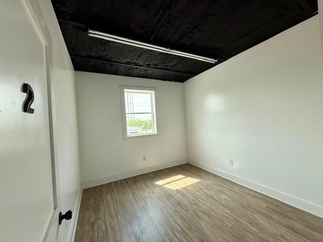617 Main St, Lexington, TX 78947 - empty room featuring wood finished floors and baseboards