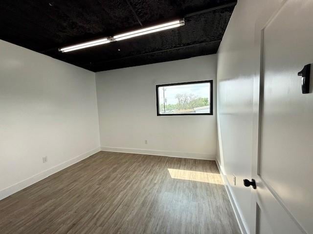 617 Main St, Lexington, TX 78947 - spare room featuring wood finished floors and baseboards