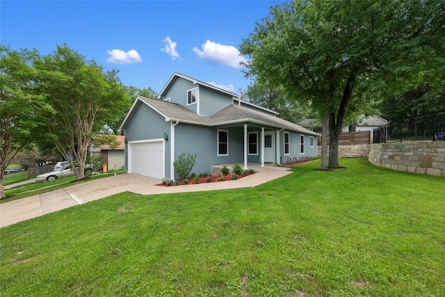 view of front facade featuring a front yard, a garage, driveway, stucco siding, and fence