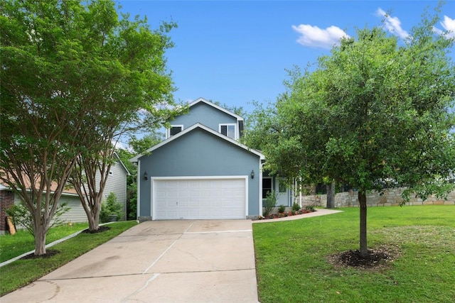 view of front of property featuring an attached garage, a front yard, driveway, and stucco siding