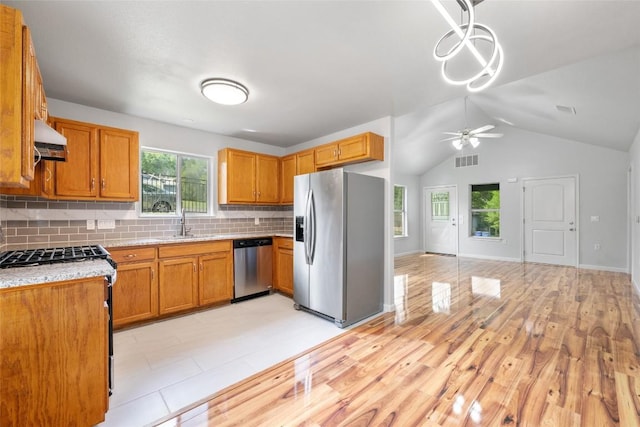 kitchen featuring ceiling fan, visible vents, stainless steel appliances, light countertops, and under cabinet range hood