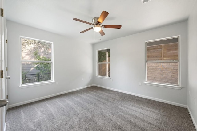 unfurnished room featuring baseboards, a ceiling fan, and carpet flooring