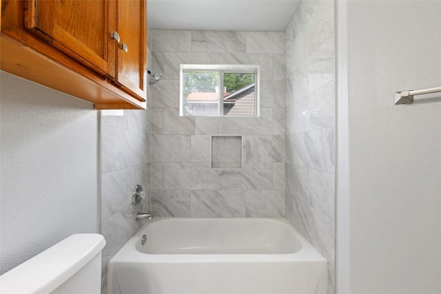 bathroom featuring toilet and shower / bath combination