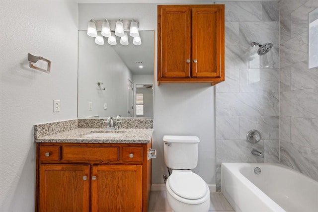 bathroom featuring toilet, vanity, and  shower combination