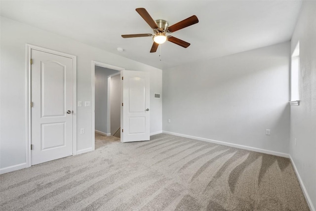 unfurnished bedroom with baseboards, ceiling fan, and carpet floors