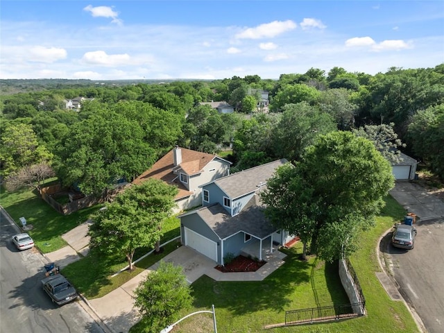 bird's eye view featuring a wooded view