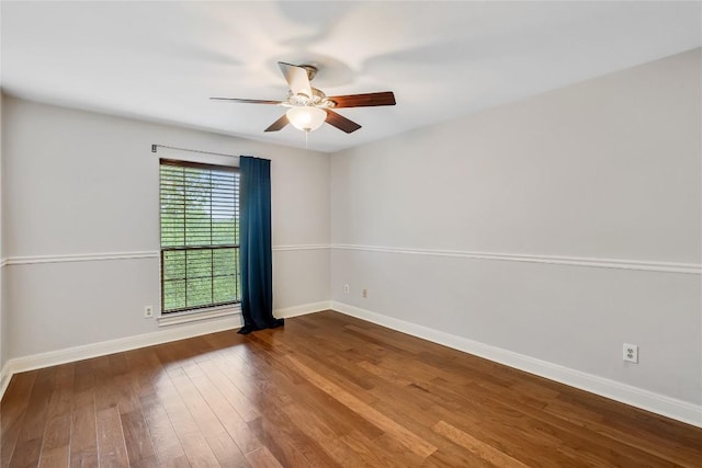 11609 Woodland Hills Trl, Austin, TX 78732 - spare room featuring a ceiling fan, wood finished floors, and baseboards