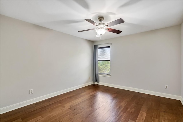 11609 Woodland Hills Trl, Austin, TX 78732 - spare room featuring baseboards, dark wood-style flooring, and a ceiling fan