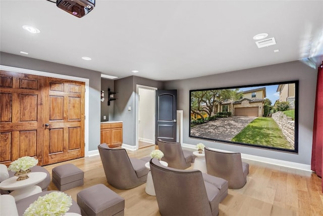 11609 Woodland Hills Trl, Austin, TX 78732 - cinema with light wood-type flooring, baseboards, and recessed lighting
