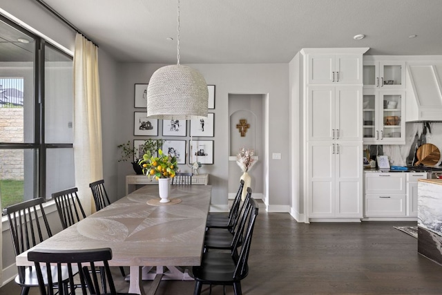 4525 Via Roma Pass, Leander, TX 78641 - dining room featuring dark wood-type flooring and baseboards