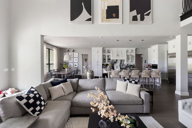 4525 Via Roma Pass, Leander, TX 78641 - living room featuring a towering ceiling and dark wood-style floors