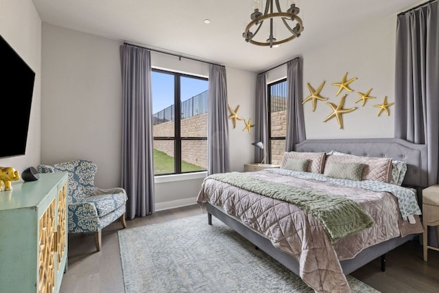 4525 Via Roma Pass, Leander, TX 78641 - bedroom with a chandelier and wood finished floors